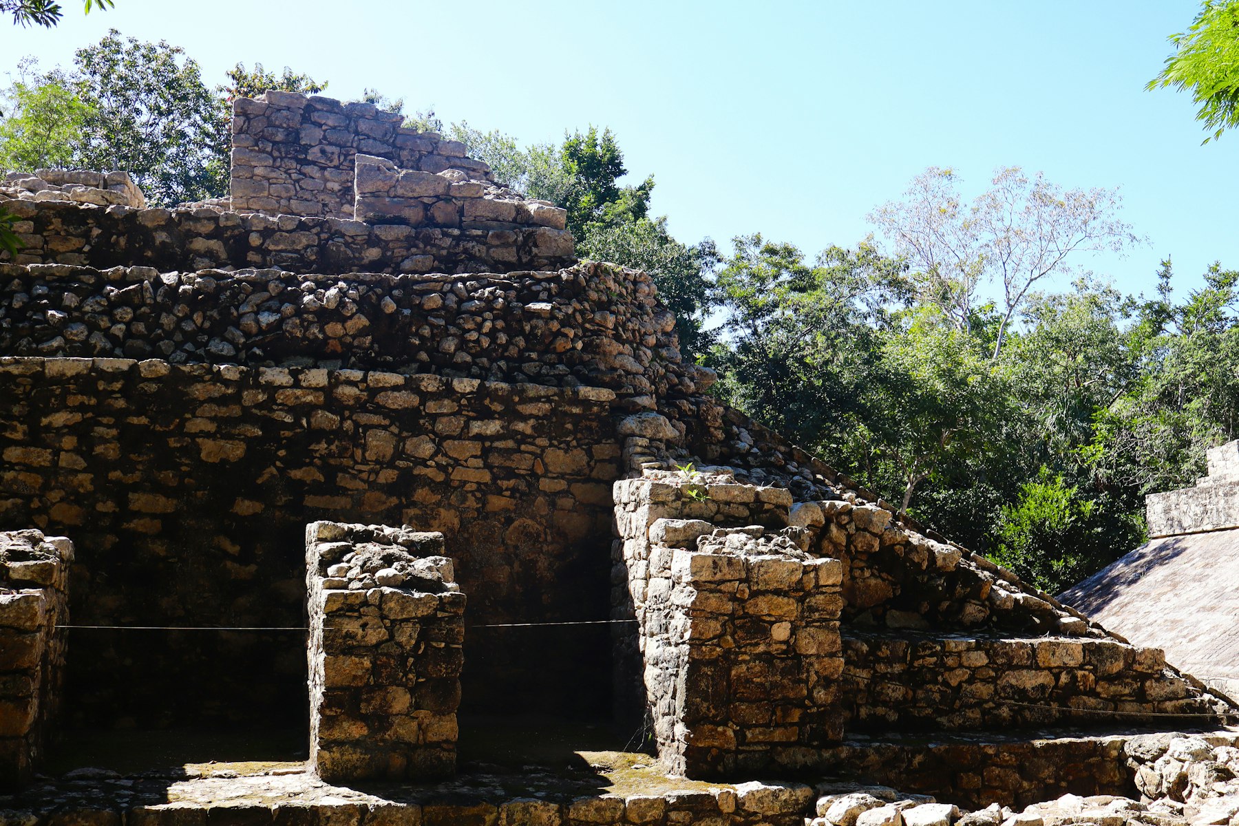 The stepped stone ruins of Cobá rising into the canopy of the Quintana Roo jungle.