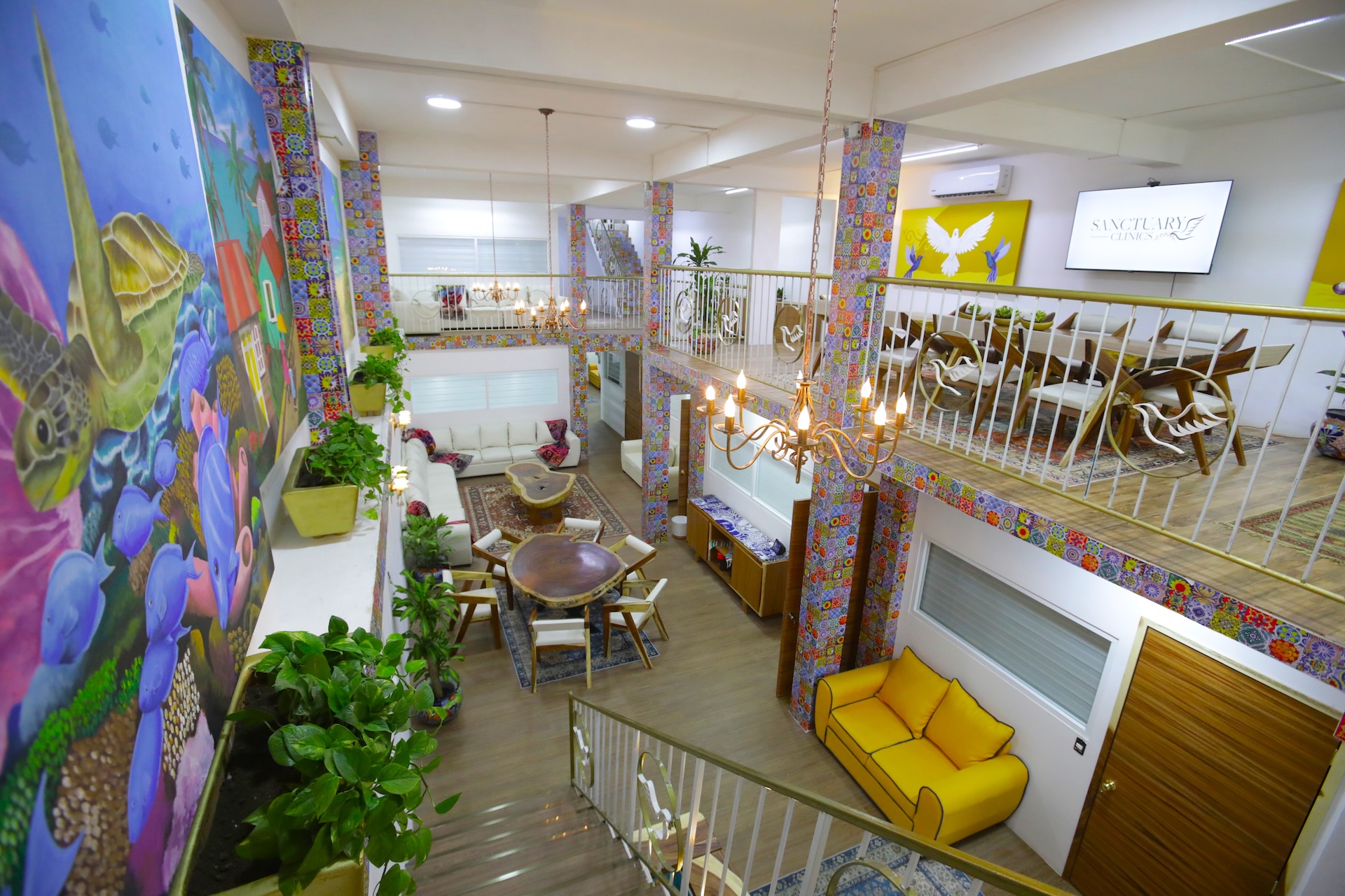 The bright, plant-filled interior lounge at Sanctuary Clinics Cozumel — a clean, comfortable, secure setting for medically supervised detox